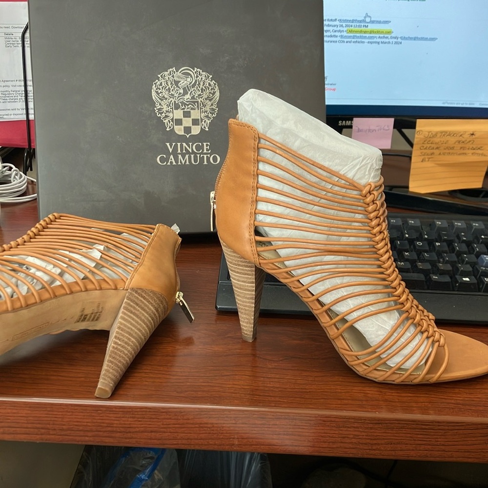 NEVER worn Vince Camuto and comfortable -they call it brick color